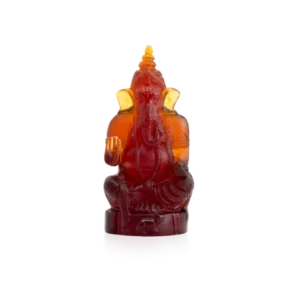 Sculpture d'une divinité Ganesha en pâte de verre de la prestigieuse cristallerie Daum. Couleur ambre foncé.